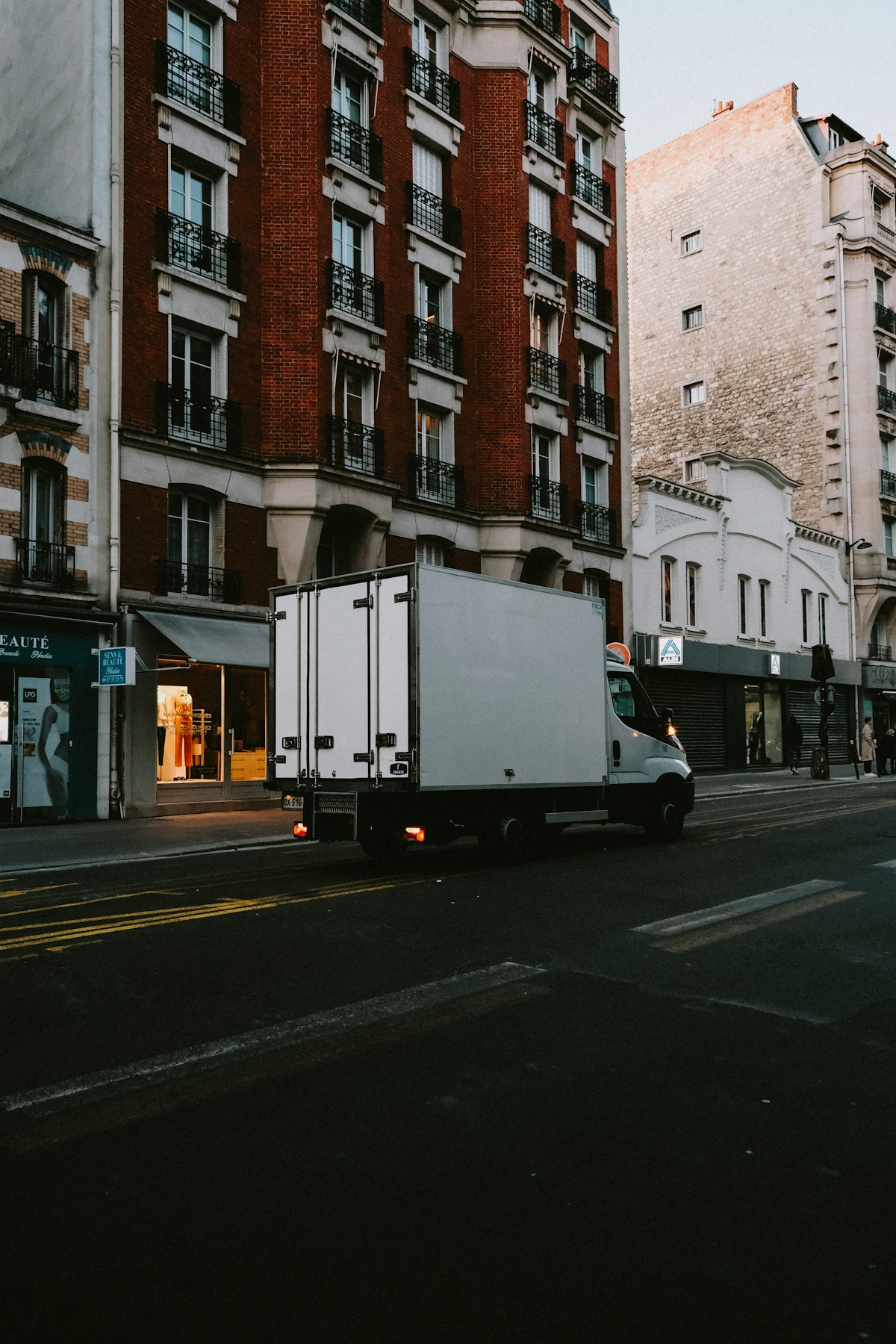 Delivery box truck on a city street for residential donation pickup